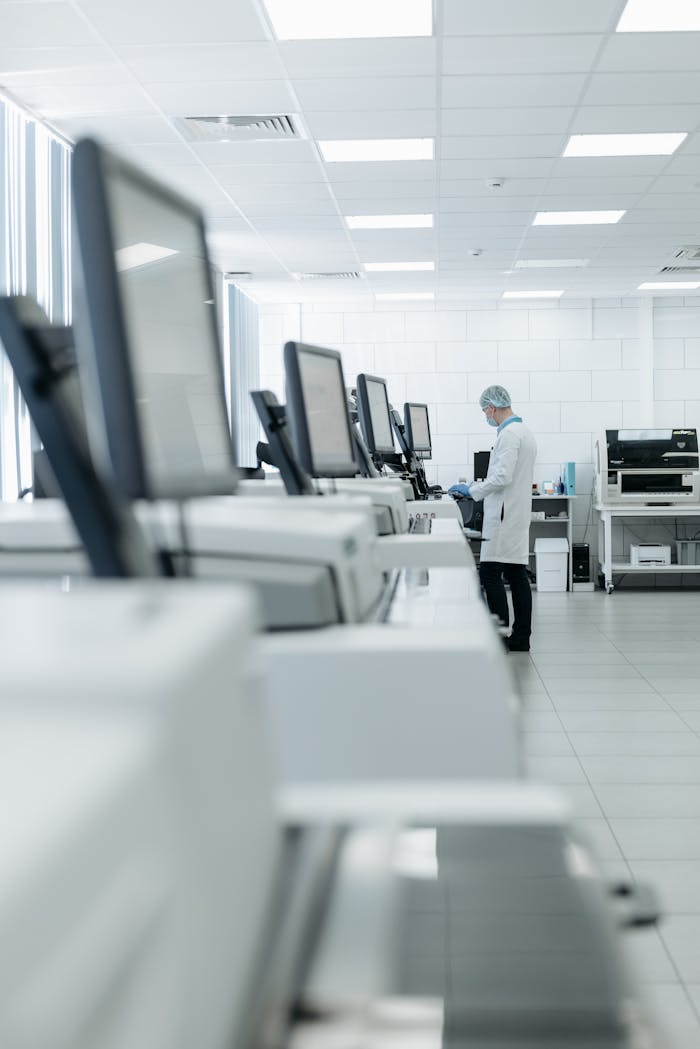 services-02 Medical professional in a modern lab using advanced equipment for research.